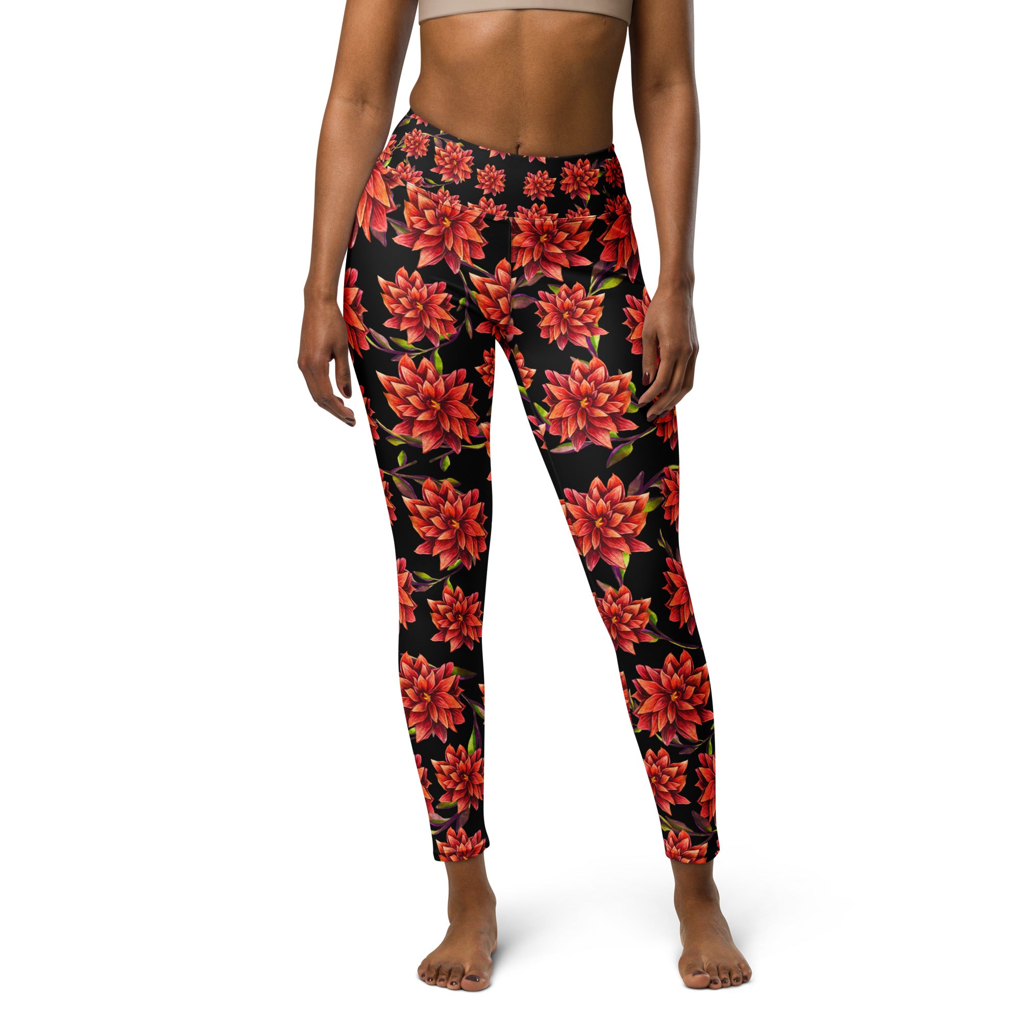 Women's high-waist yoga leggings featuring a bold red floral print on a black background. Stylish, stretchy, and designed for yoga, workouts, and everyday activewear