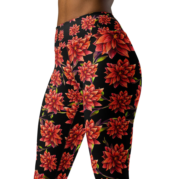 Women's high-waist yoga leggings featuring a bold red floral print on a black background. Stylish, stretchy, and designed for yoga, workouts, and everyday activewear